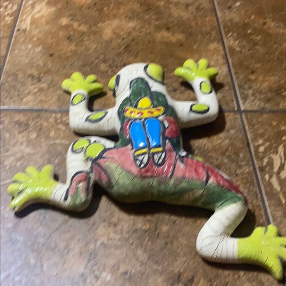 Frog decoration with sleeping man.
